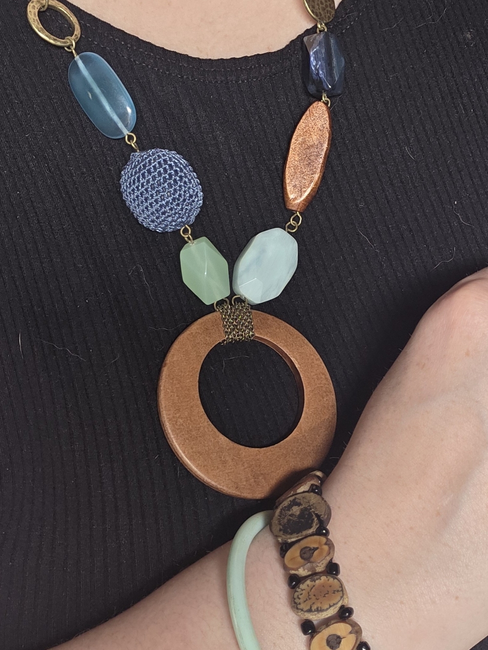 Multi-colored necklace And Bracelet Set with blue, green, and wooden beads.